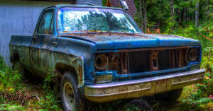 An image of an old blue pickup truck.