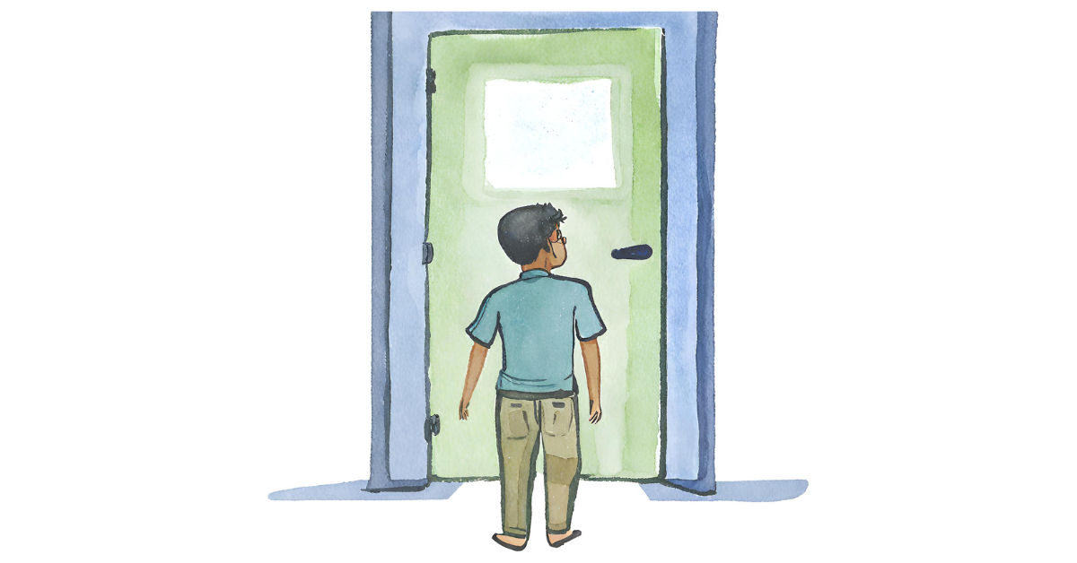 A Latino boy in front of the closed doors of an operating room. He cannot get in.