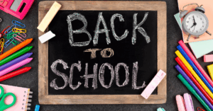 Drawing of a chalkboard that says back to school on it.